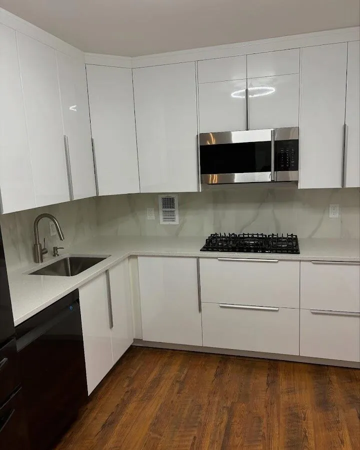 Restored kitchen with white cabinets after water damage in Hampstead